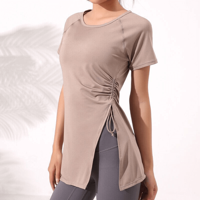 Fitness solid ladies long t-shirt with drawstring on side, perfect for yoga. Quick-dry, breathable fabric ideal for active wear.